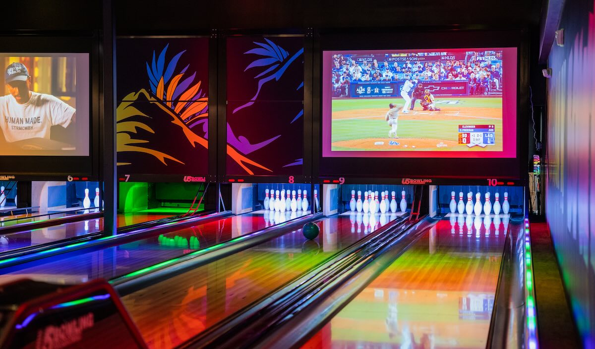 a bowling alley lit up with colorful lights